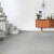 Виниловый пол Quick Step клеевой Ambient Glue Plus Шлифованный бетон светло-серый AMGP40139 фото в интерьере